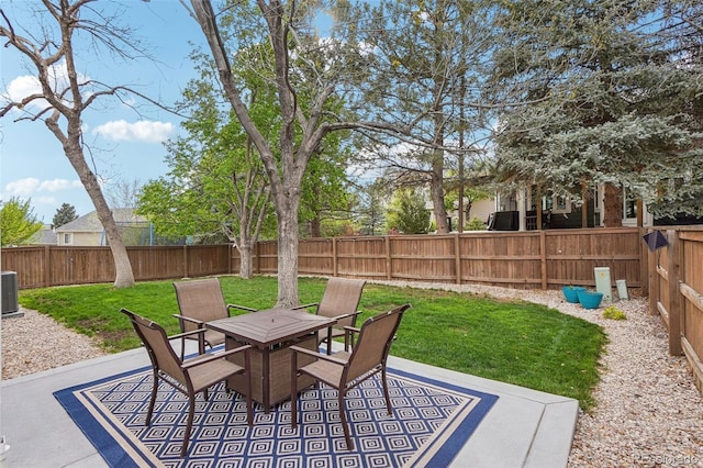 view of patio / terrace with outdoor dining space and central AC unit