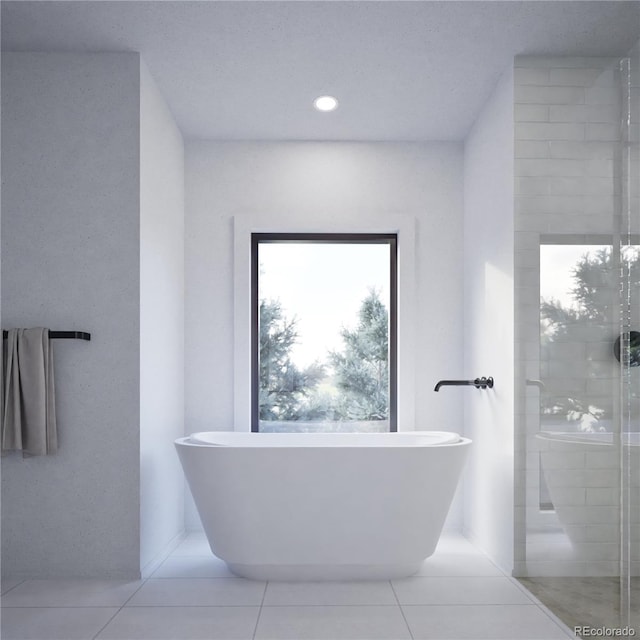 full bathroom with tile patterned flooring, a freestanding tub, a tile shower, and recessed lighting