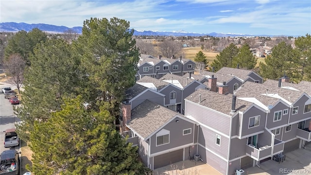 birds eye view of property with a mountain view and a residential view