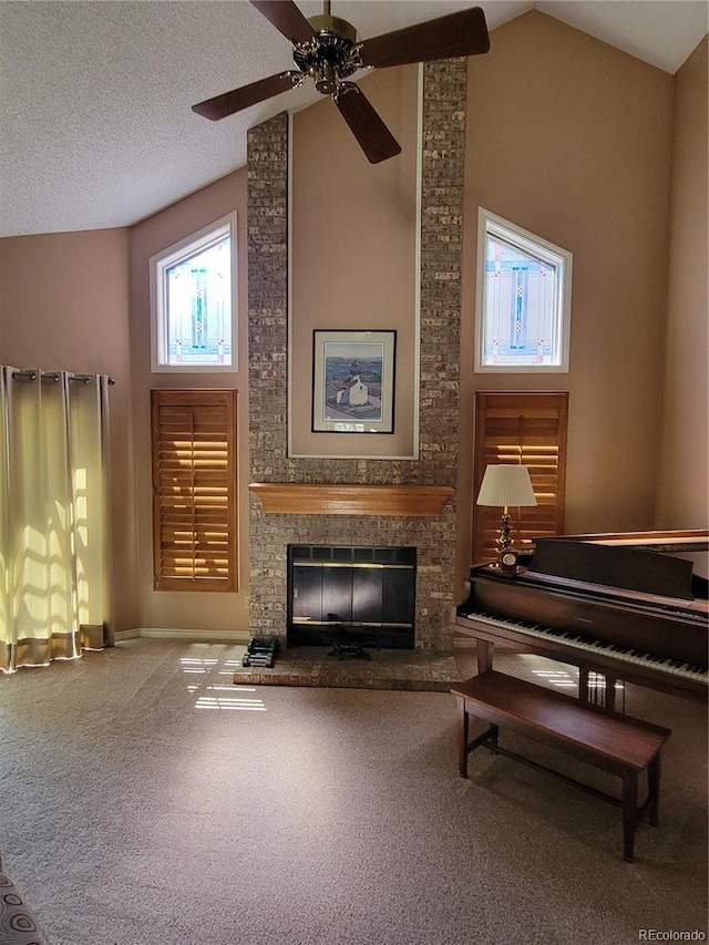 2619 S Iris Ct, Lakewood, CO 80227 - living area featuring a fireplace, carpet, lofted ceiling, and a ceiling fan