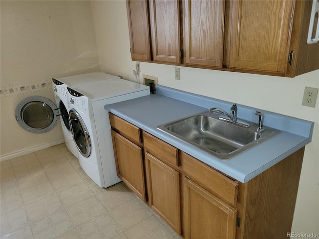 2619 S Iris Ct, Lakewood, CO 80227 - laundry area featuring cabinet space, light flooring, and washing machine and clothes dryer