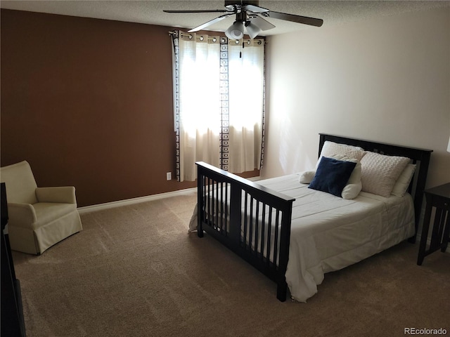 2619 S Iris Ct, Lakewood, CO 80227 - bedroom with carpet floors, a textured ceiling, a ceiling fan, and baseboards