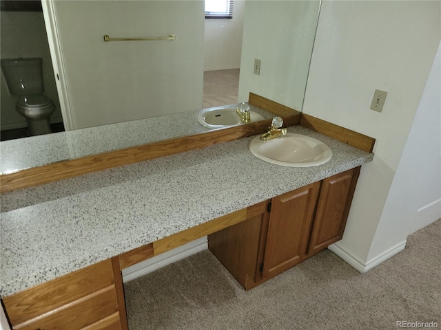 2619 S Iris Ct, Lakewood, CO 80227 - bathroom featuring vanity and toilet