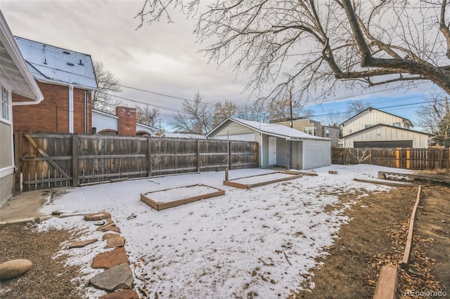 yard layered in snow with an outdoor structure