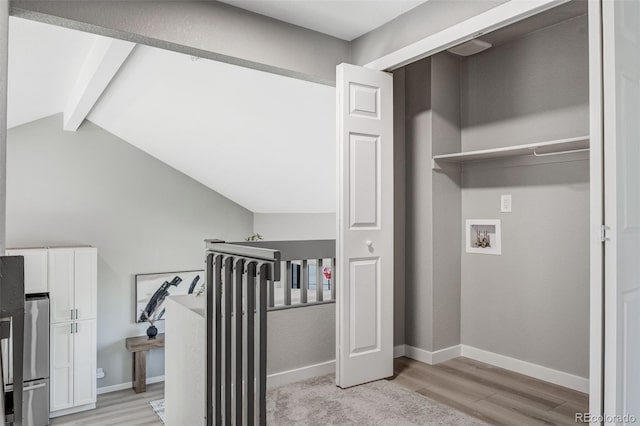 laundry room with laundry area, light wood-style flooring, washer hookup, and baseboards