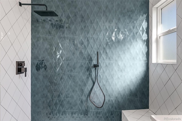 bathroom with a tile shower