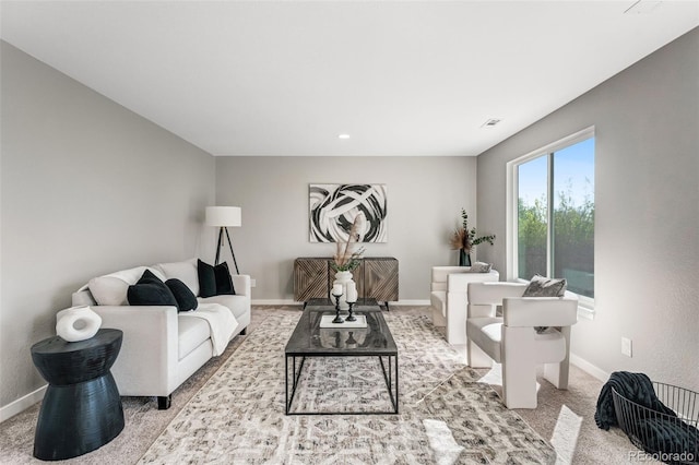 living room featuring visible vents, baseboards, and carpet floors