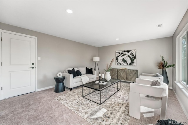 living area featuring carpet, baseboards, visible vents, and recessed lighting