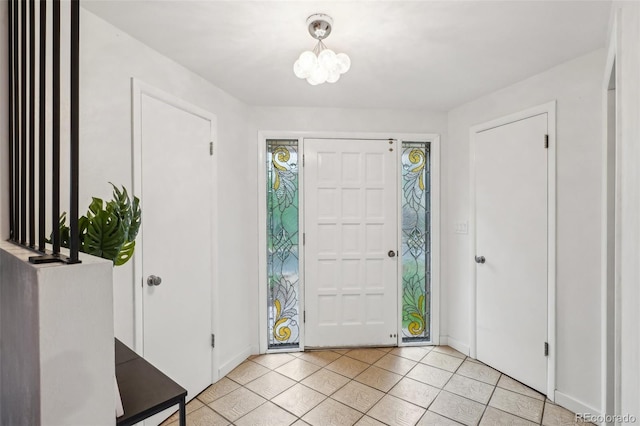 entrance foyer with light tile patterned floors
