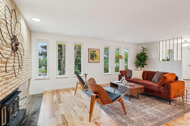 living area featuring healthy amount of natural light and wood finished floors