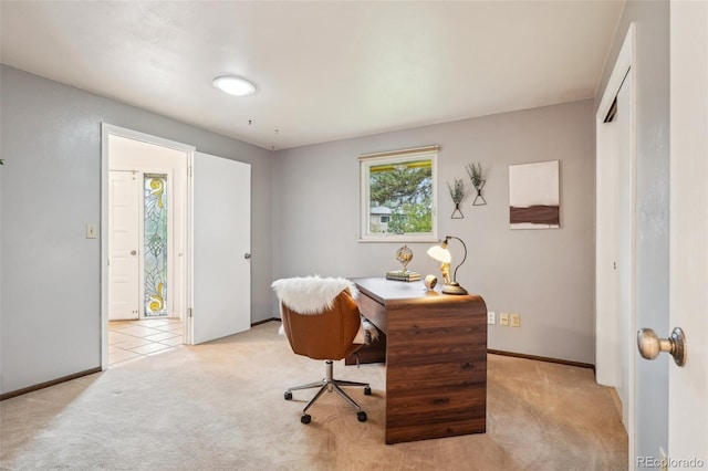 home office with carpet floors and baseboards
