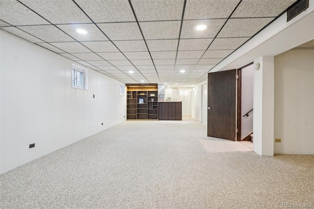 basement featuring carpet flooring, recessed lighting, and stairway