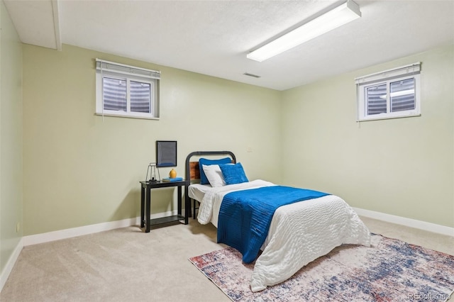 bedroom with carpet floors and baseboards