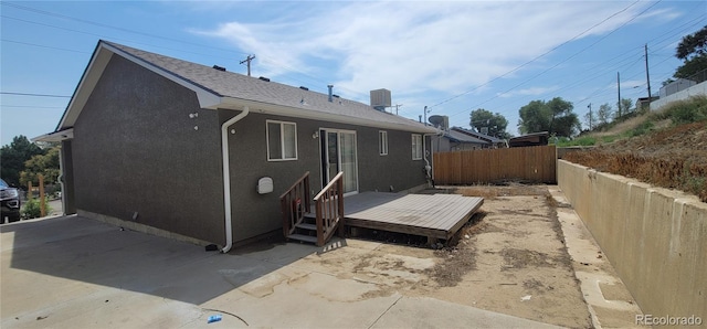 back of property with a patio