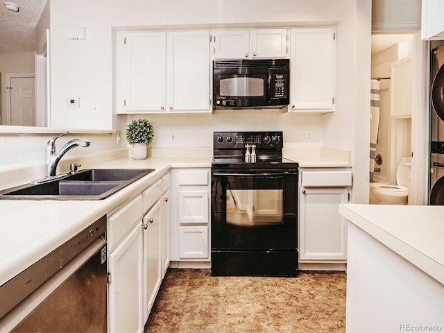 13894 E Lehigh Ave Unit G, Aurora, CO 80014 - kitchen featuring black appliances, stacked washer / drying machine, a sink, and light countertops