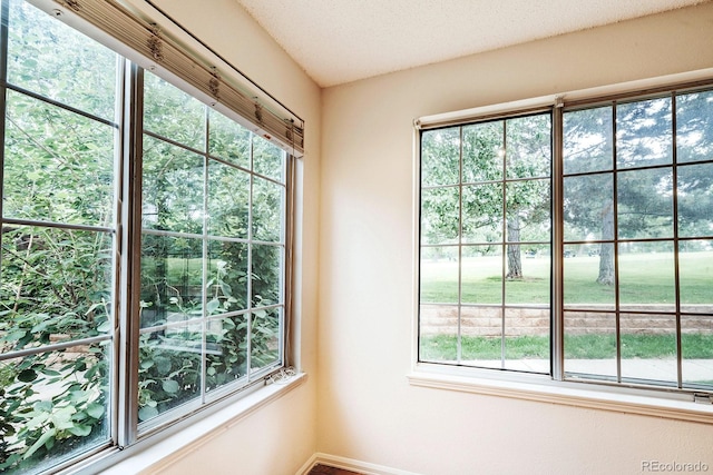 13894 E Lehigh Ave Unit G, Aurora, CO 80014 - empty room with plenty of natural light and baseboards
