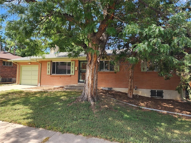 6525 E Harvard Ave, Denver, CO 80224 - ranch-style house featuring a garage, a front lawn, driveway, and brick siding