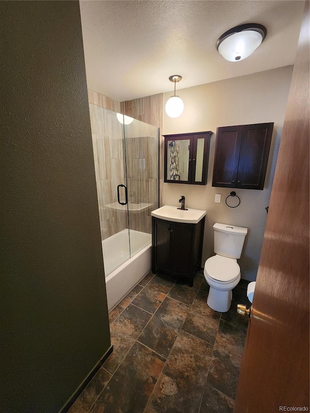 6525 E Harvard Ave, Denver, CO 80224 - bathroom featuring vanity, shower / washtub combination, and stone tile flooring
