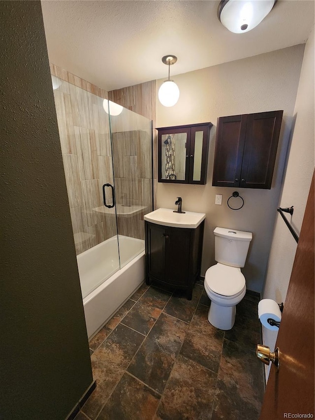 6525 E Harvard Ave, Denver, CO 80224 - bathroom featuring vanity, stone tile floors, and shower / washtub combination