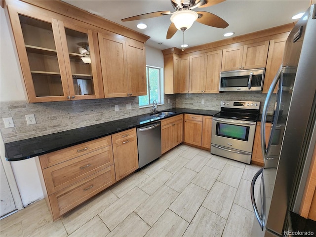6525 E Harvard Ave, Denver, CO 80224 - kitchen featuring appliances with stainless steel finishes, a ceiling fan, tasteful backsplash, glass insert cabinets, and recessed lighting
