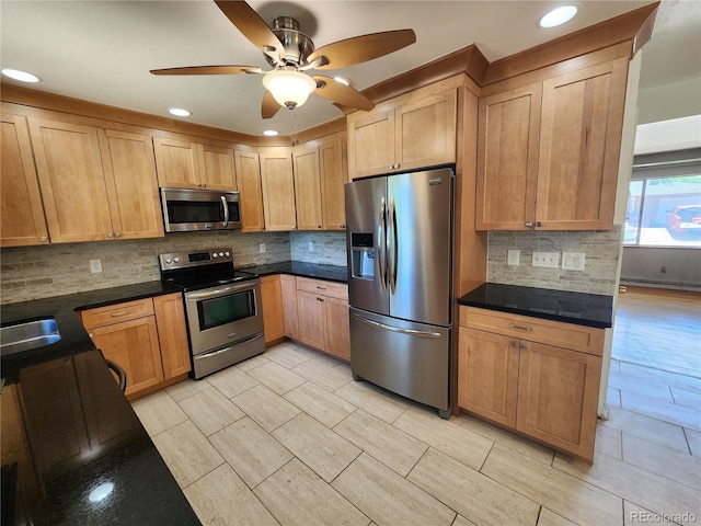 6525 E Harvard Ave, Denver, CO 80224 - kitchen featuring appliances with stainless steel finishes, decorative backsplash, ceiling fan, recessed lighting, and baseboard heating