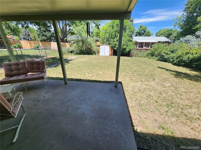 6525 E Harvard Ave, Denver, CO 80224 - view of yard featuring a storage unit and a patio area