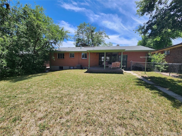 6525 E Harvard Ave, Denver, CO 80224 - back of house with a patio and brick siding