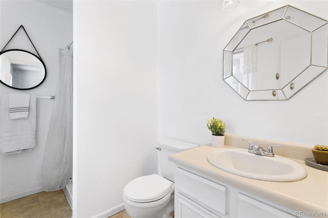 bathroom with toilet, vanity, and a shower with shower curtain