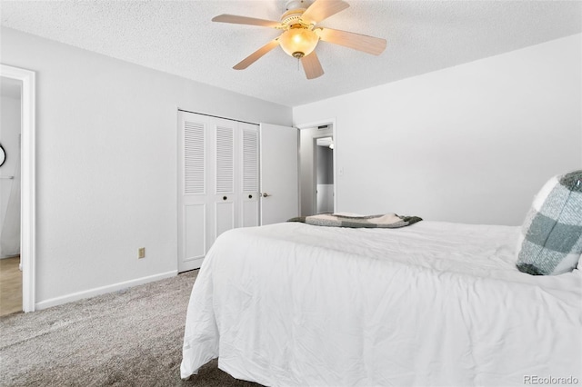 bedroom featuring carpet, a textured ceiling, a closet, and ceiling fan