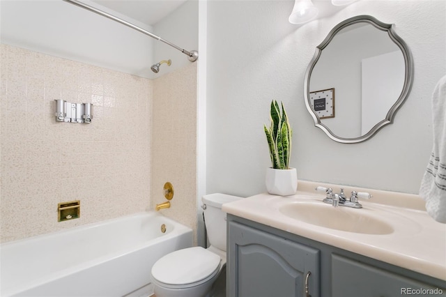 full bathroom featuring toilet, vanity, and tiled shower / bath