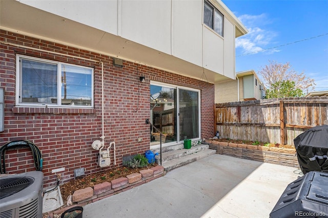 8666 Mariposa St, Thornton, CO 80260 - view of patio with entry steps, fence, and cooling unit