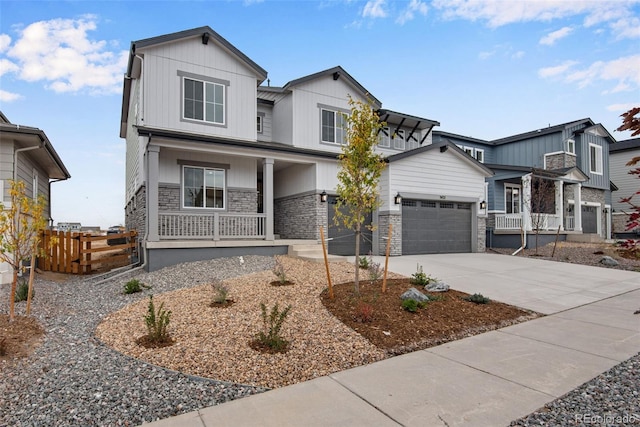 view of front of home featuring a garage and a porch