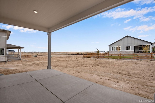 view of yard with a patio and a rural view