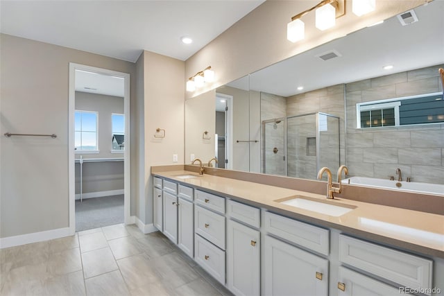 bathroom featuring vanity, tile patterned floors, and a shower with door