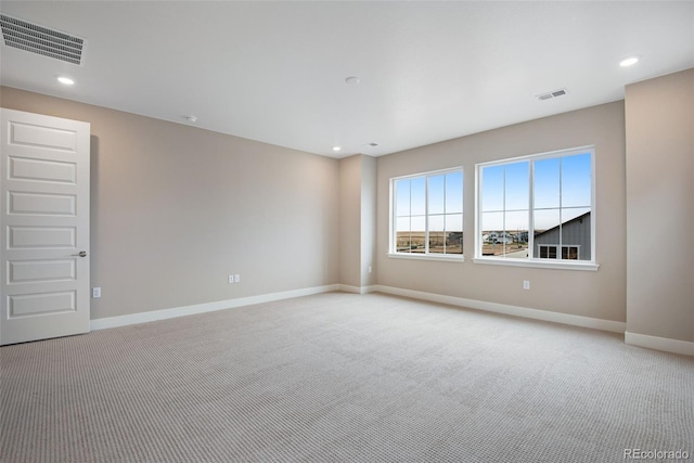 empty room with light colored carpet