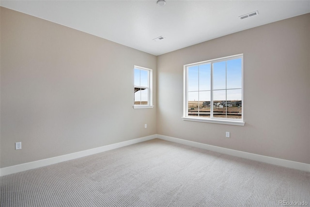 unfurnished room featuring carpet