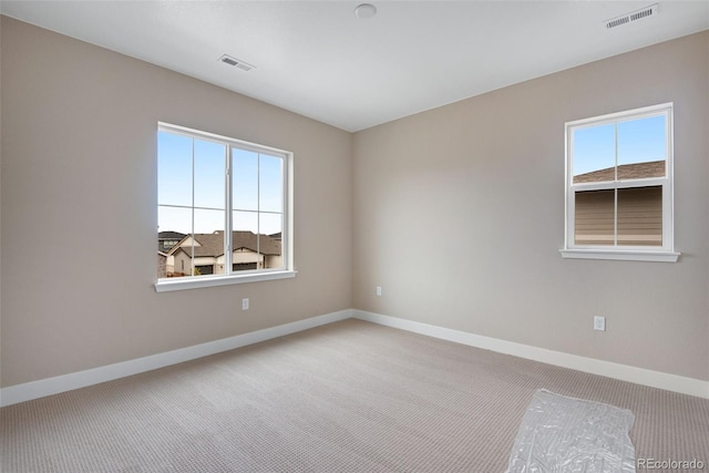 spare room featuring carpet floors