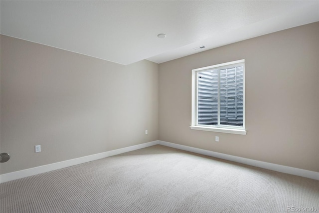 empty room with carpet flooring