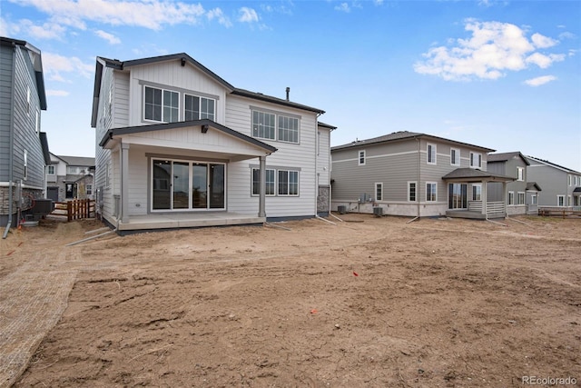 rear view of property featuring a patio