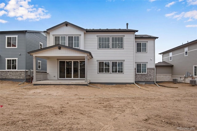 rear view of property with a patio and central air condition unit