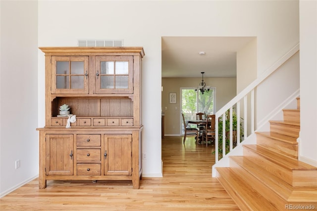 21105 Willow Park Pl, Parker, CO 80138 - interior space with a chandelier, light wood-style flooring, and stairs