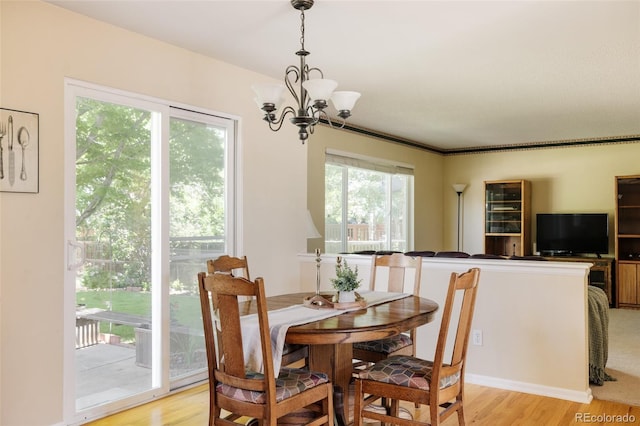 21105 Willow Park Pl, Parker, CO 80138 - dining space with light wood finished floors and a chandelier