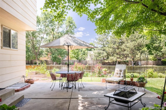 21105 Willow Park Pl, Parker, CO 80138 - fenced backyard with an outdoor fire pit, a patio, and outdoor dining space