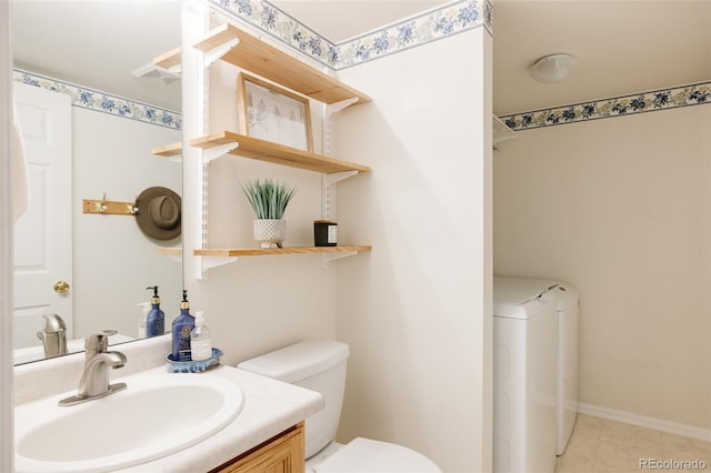 21105 Willow Park Pl, Parker, CO 80138 - bathroom with washer / dryer, vanity, and tile patterned flooring