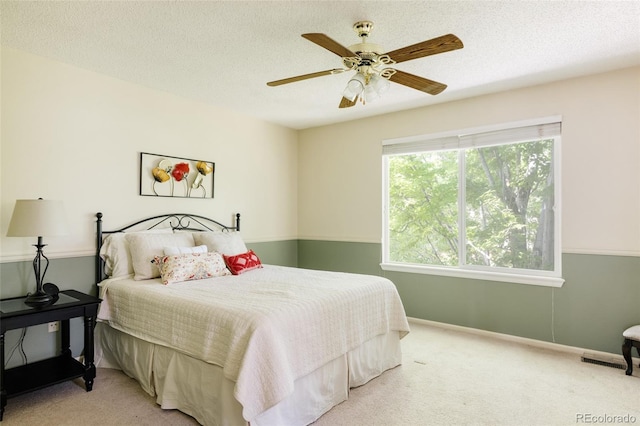 21105 Willow Park Pl, Parker, CO 80138 - bedroom with light colored carpet, ceiling fan, and a textured ceiling