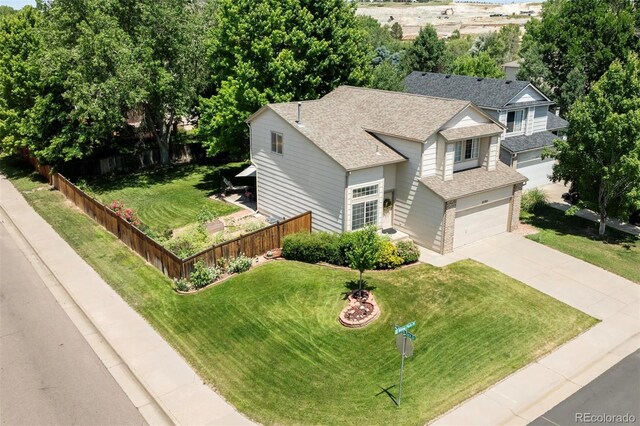 21105 Willow Park Pl, Parker, CO 80138 - view of front of house with roof with shingles, driveway, and a garage