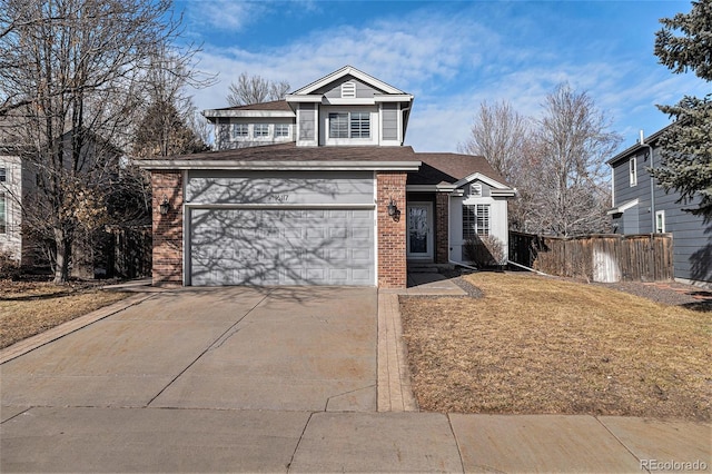 front facade featuring a garage and a front yard