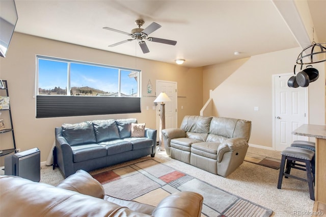 living room featuring ceiling fan and light carpet