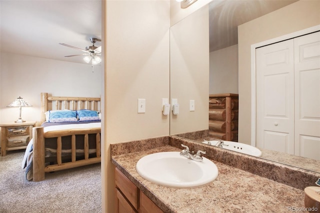 bathroom featuring ceiling fan and vanity