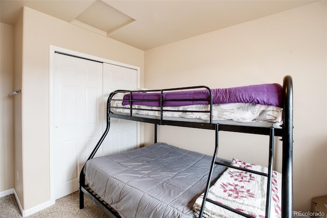 bedroom featuring a closet and carpet flooring